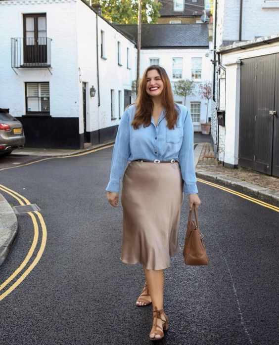 Light blue shirt with a beige silk midi skirt